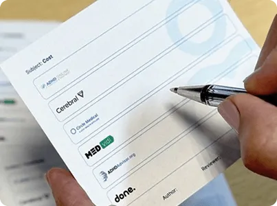 image of hand holding a pen over a providor card